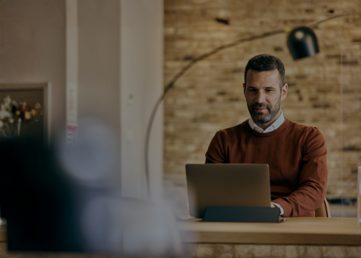 man working on laptop in office